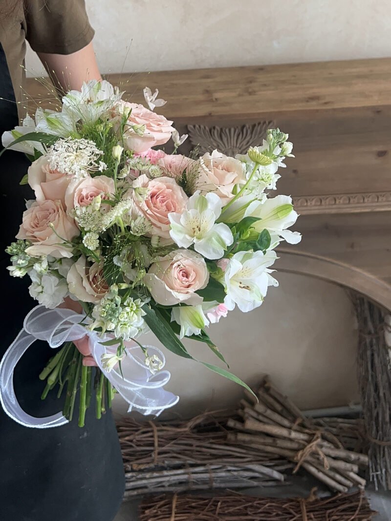 Full view of Quicksand Bliss garden-style bridal bouquet in blush pink and white