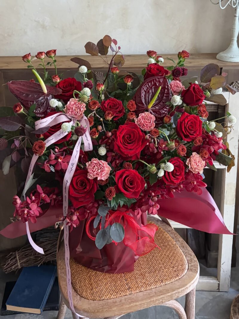 Full view of Red Velvet romantic flower box with red roses and burgundy flowers