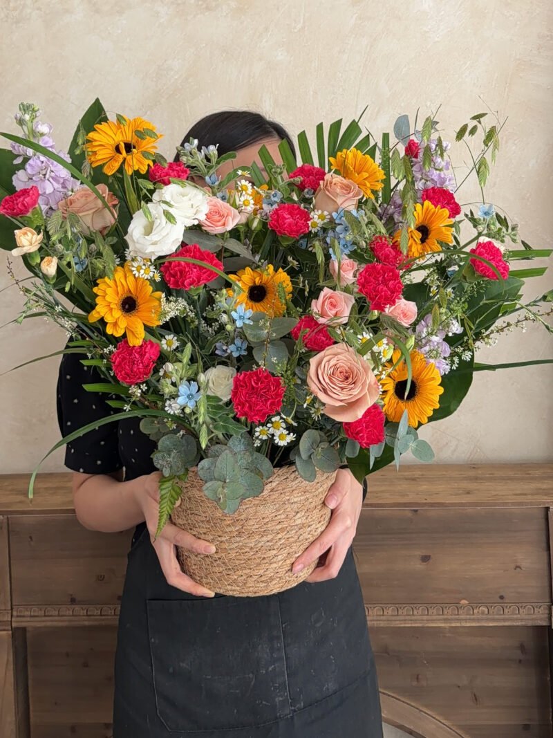 Vibrant Garden colourful flower box with orange gerberas and bright pink flowers